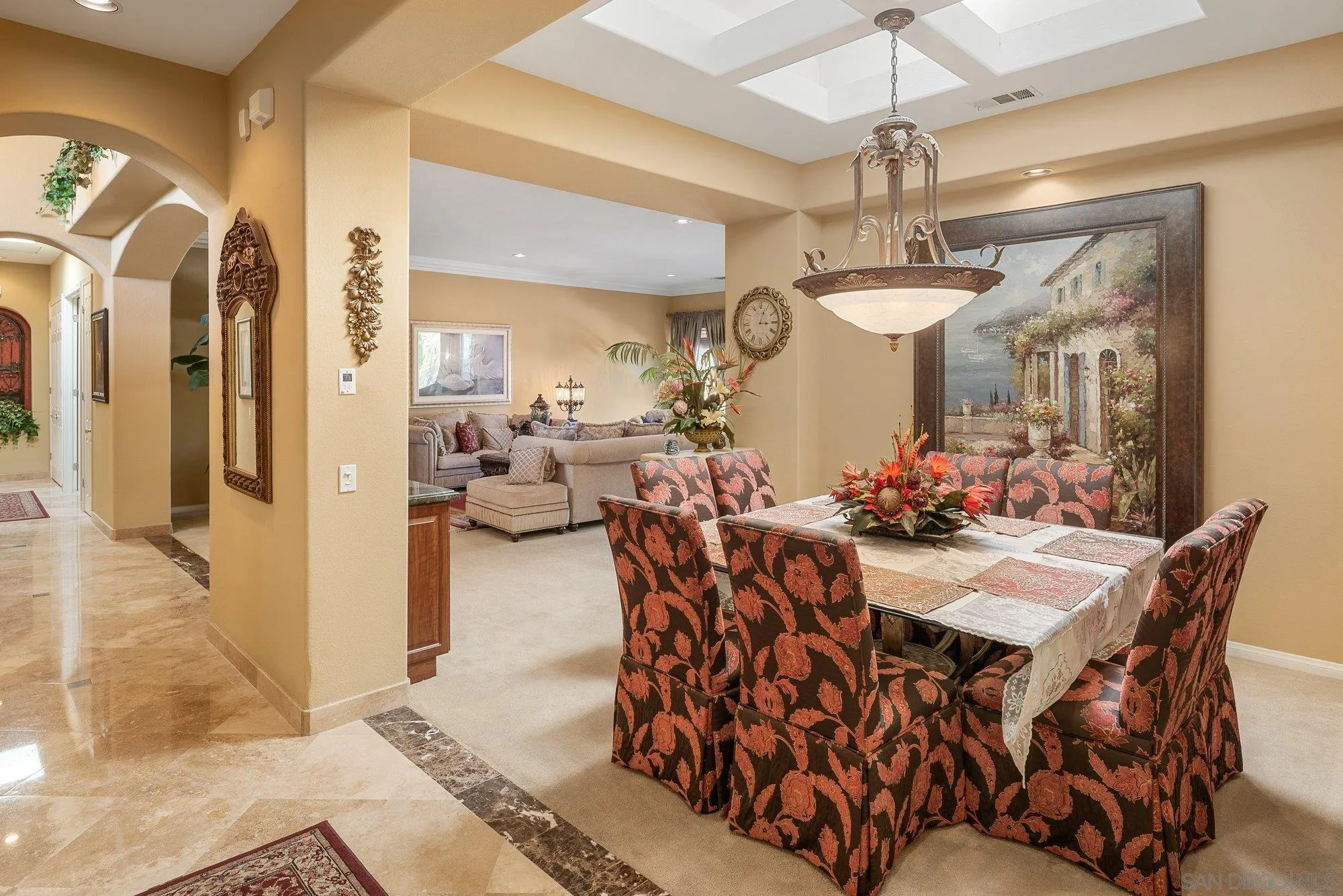 4 Chandon Court Rancho Mirage, CA 92270 - Photo 11 of 44 a view of a dining room with furniture and a chandelier fan
