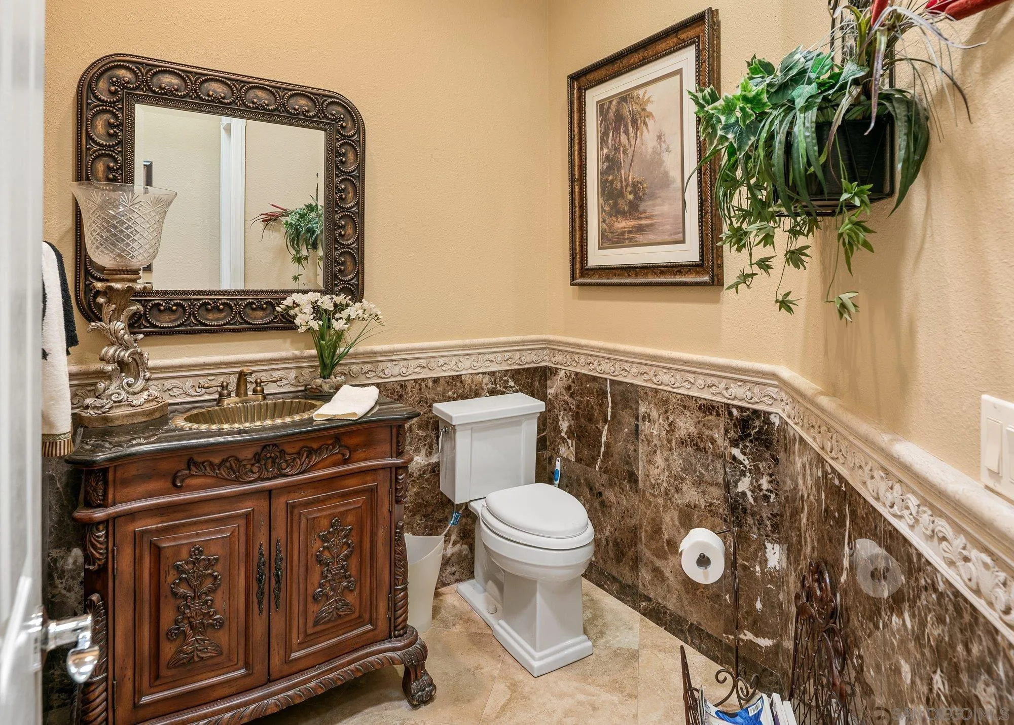 4 Chandon Court Rancho Mirage, CA 92270 - Photo 12 of 44 a bathroom with a toilet a sink and mirror