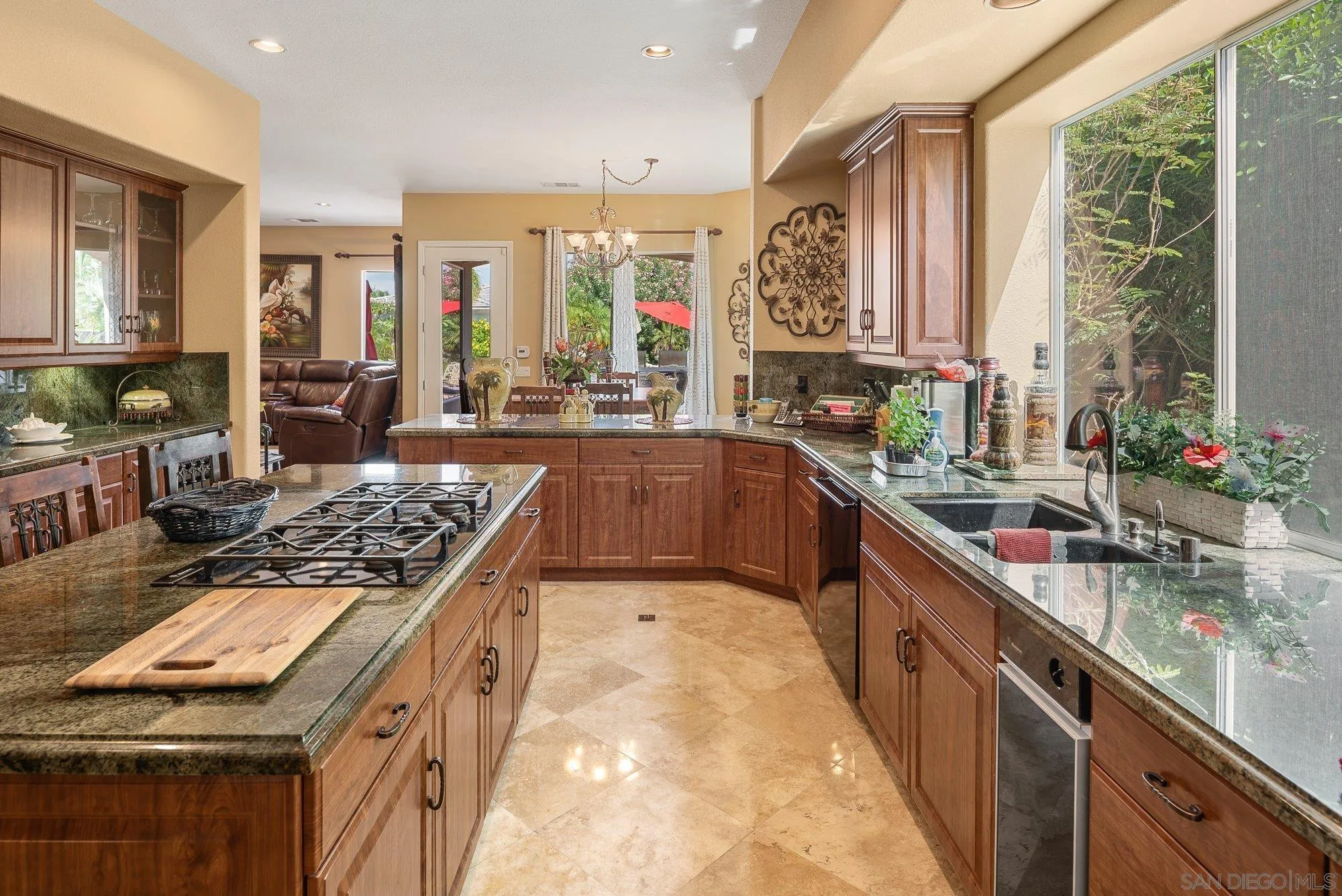 4 Chandon Court Rancho Mirage, CA 92270 - Photo 14 of 44 a large kitchen with stainless steel appliances granite countertop a large stove a sink dishwasher and cabinets with wooden floor