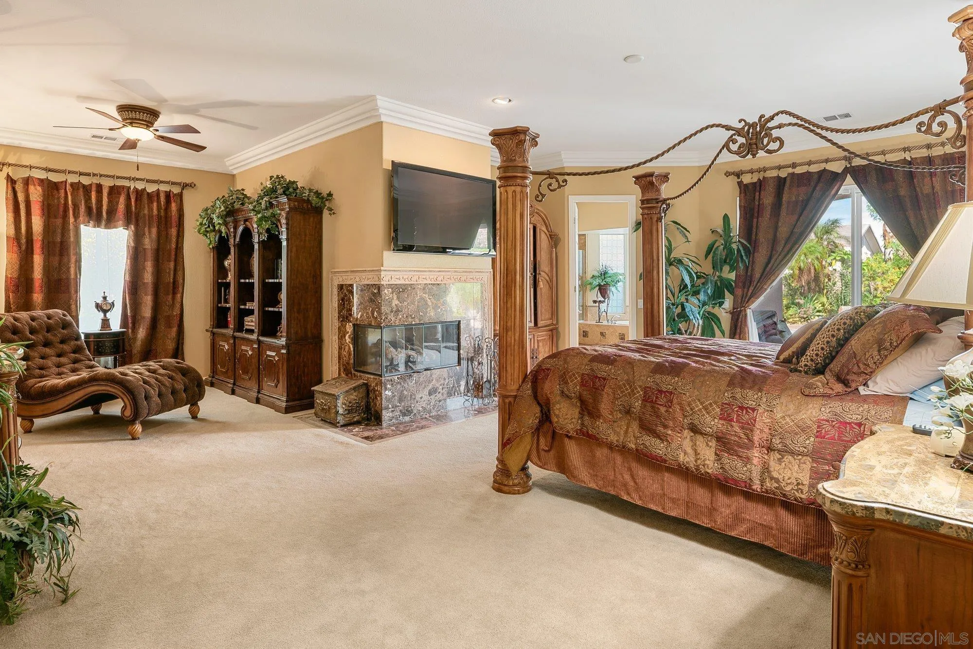 4 Chandon Court Rancho Mirage, CA 92270 - Photo 19 of 44 a bed room with a bed and a large mirror