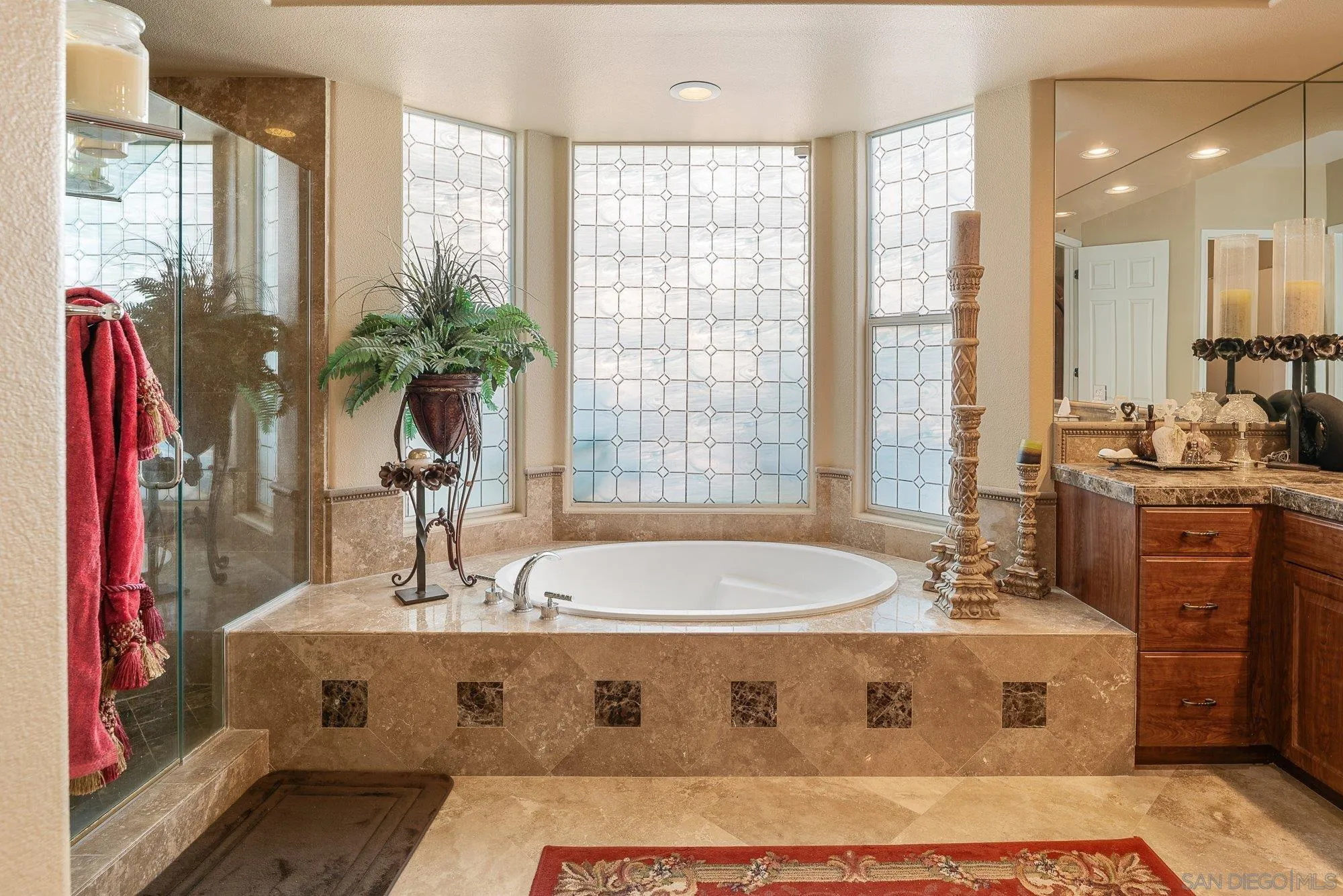 4 Chandon Court Rancho Mirage, CA 92270 - Photo 23 of 44 a spacious bathroom with a bathtub and sink