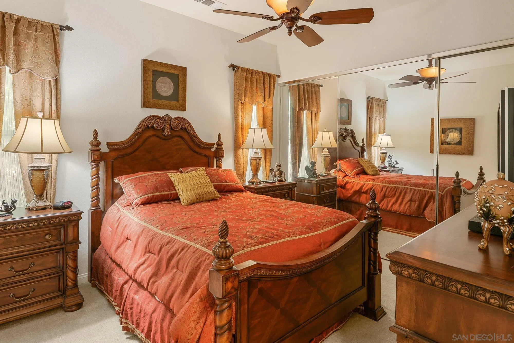 4 Chandon Court Rancho Mirage, CA 92270 - Photo 24 of 44 a bedroom with two beds and a chandelier