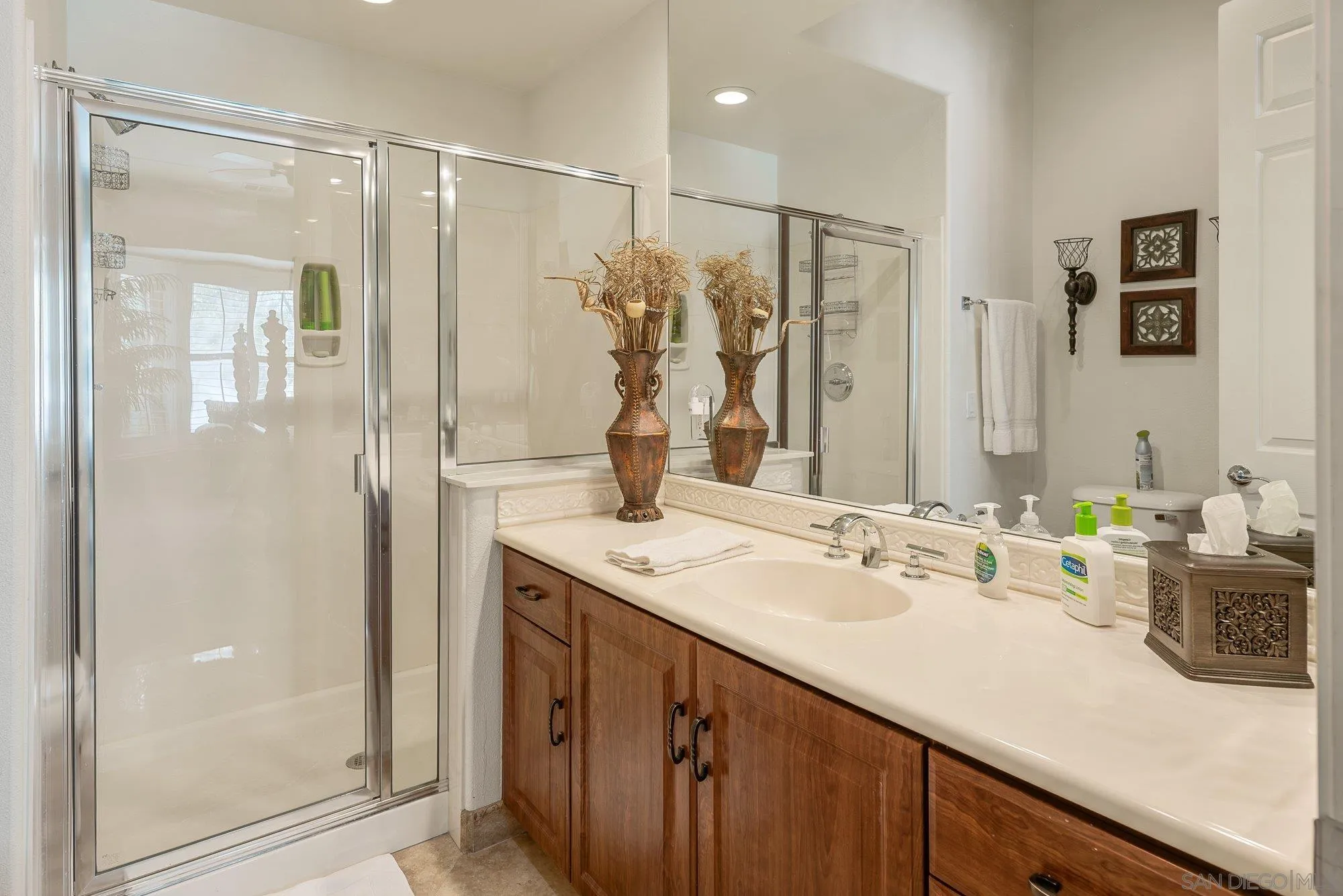 4 Chandon Court Rancho Mirage, CA 92270 - Photo 27 of 44 a bathroom with a double vanity sink mirror and shower