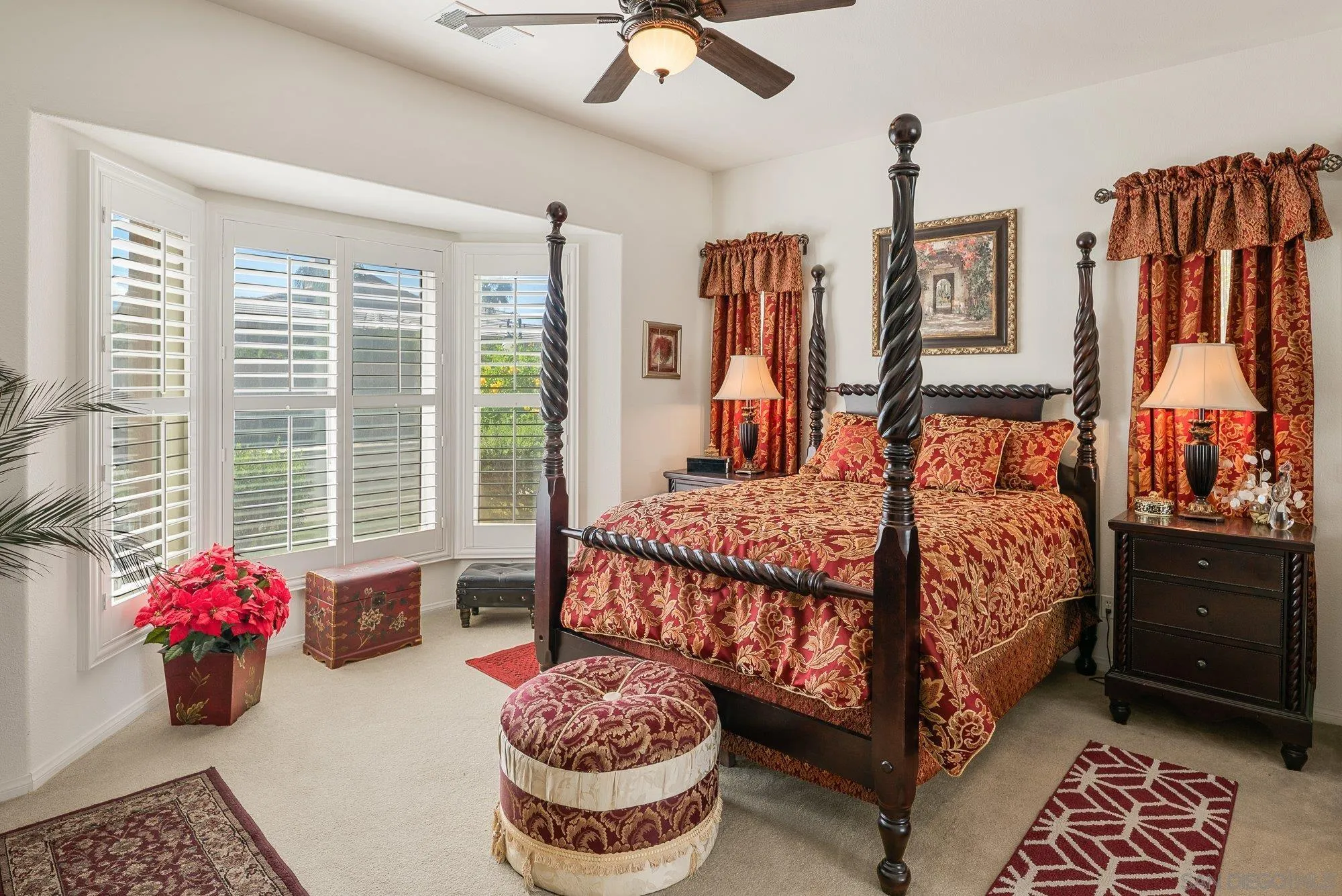 4 Chandon Court Rancho Mirage, CA 92270 - Photo 28 of 44 a bedroom with a bed and a chandelier