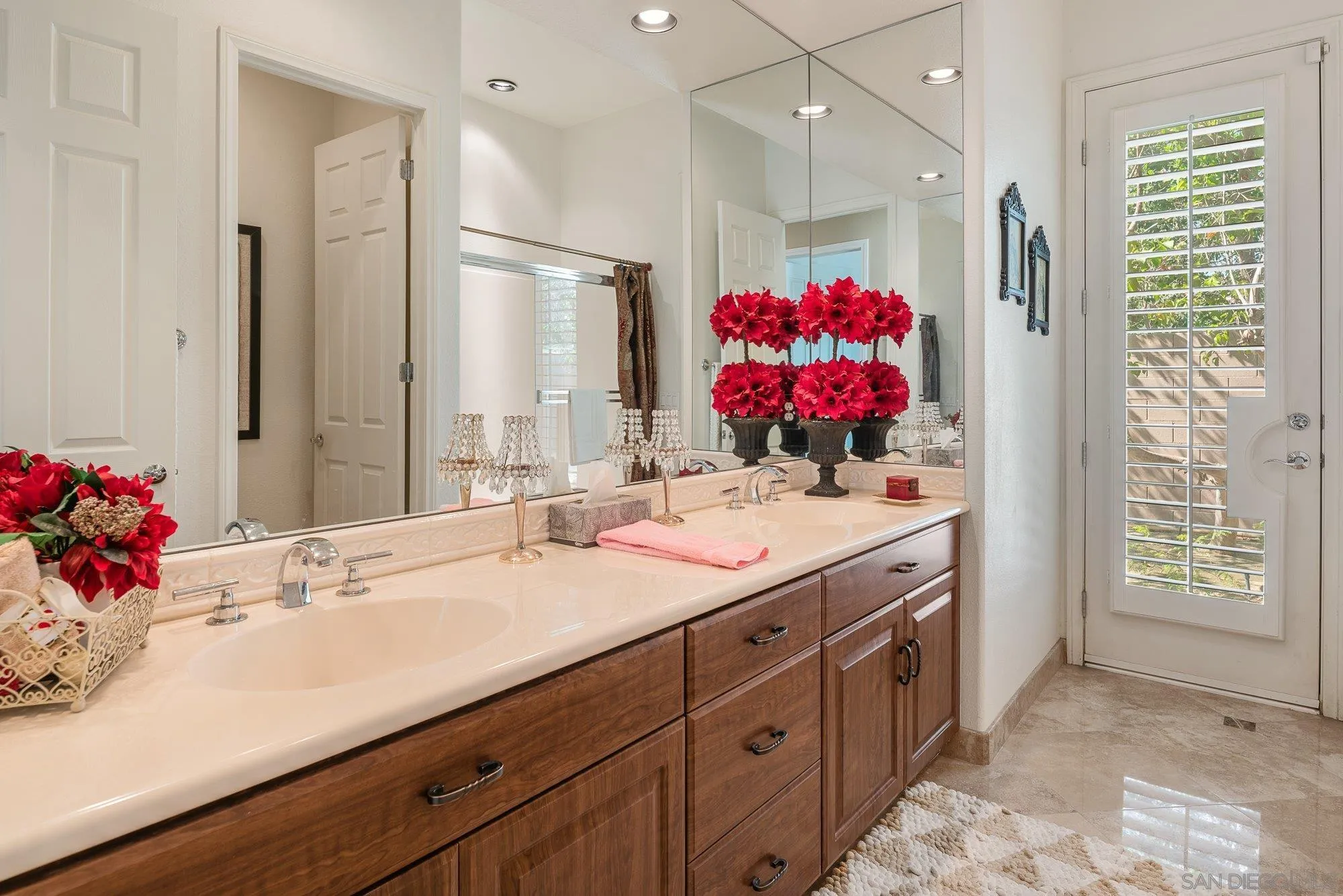 4 Chandon Court Rancho Mirage, CA 92270 - Photo 30 of 44 a bathroom with a sink vanity mirror and shower