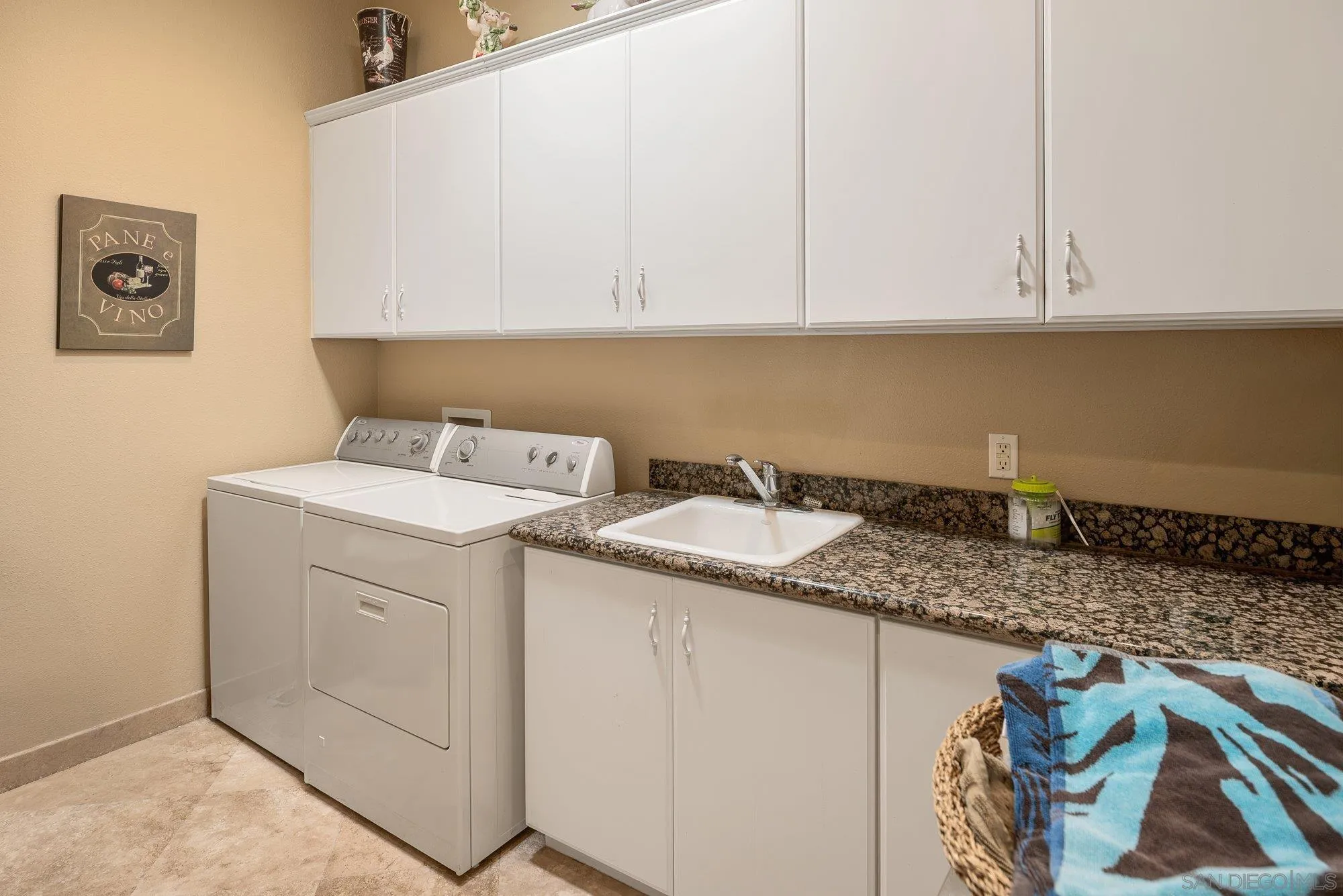 4 Chandon Court Rancho Mirage, CA 92270 - Photo 31 of 44 a utility room with sink dryer and washer