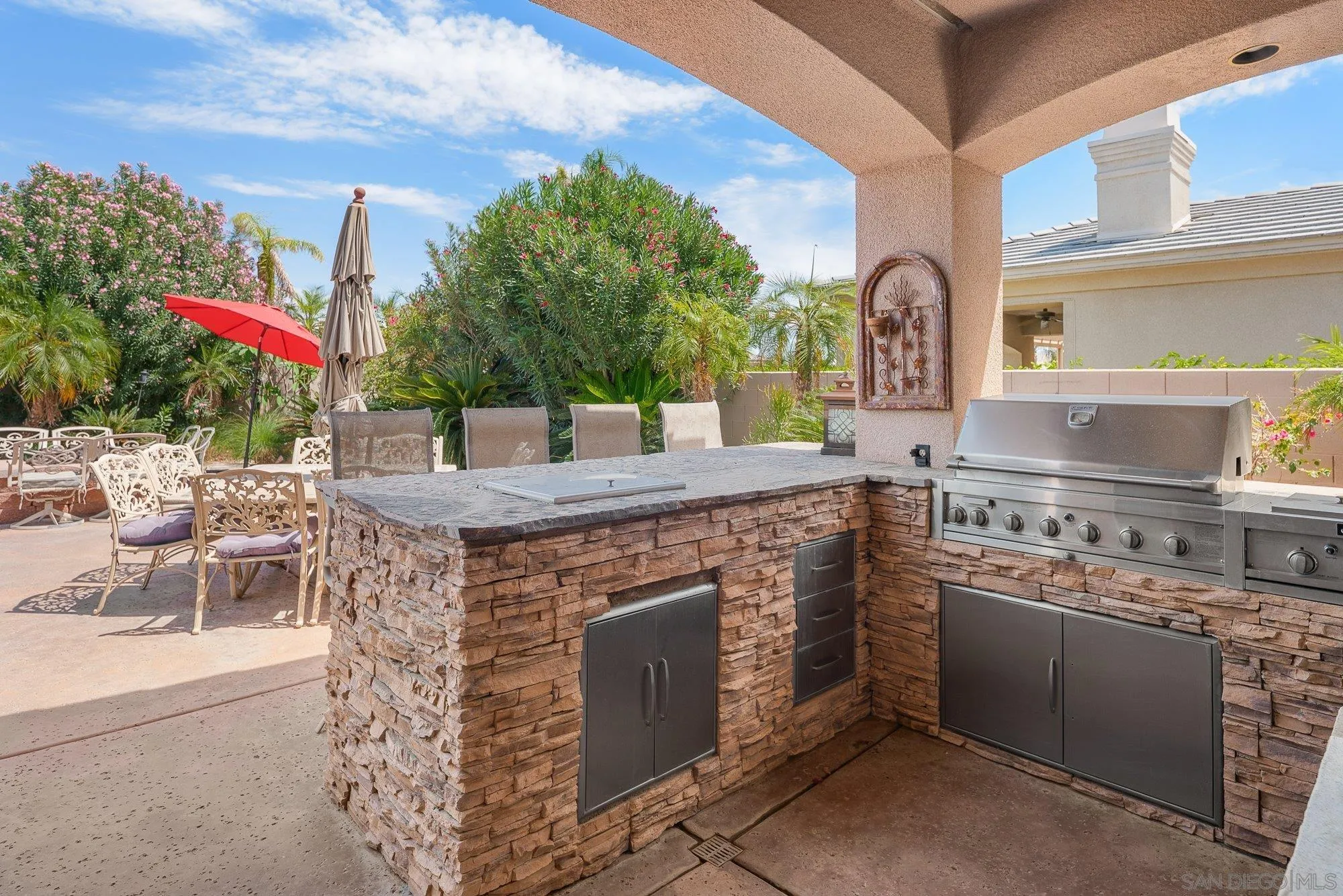 4 Chandon Court Rancho Mirage, CA 92270 - Photo 32 of 44 a open kitchen with a stove and a fireplace
