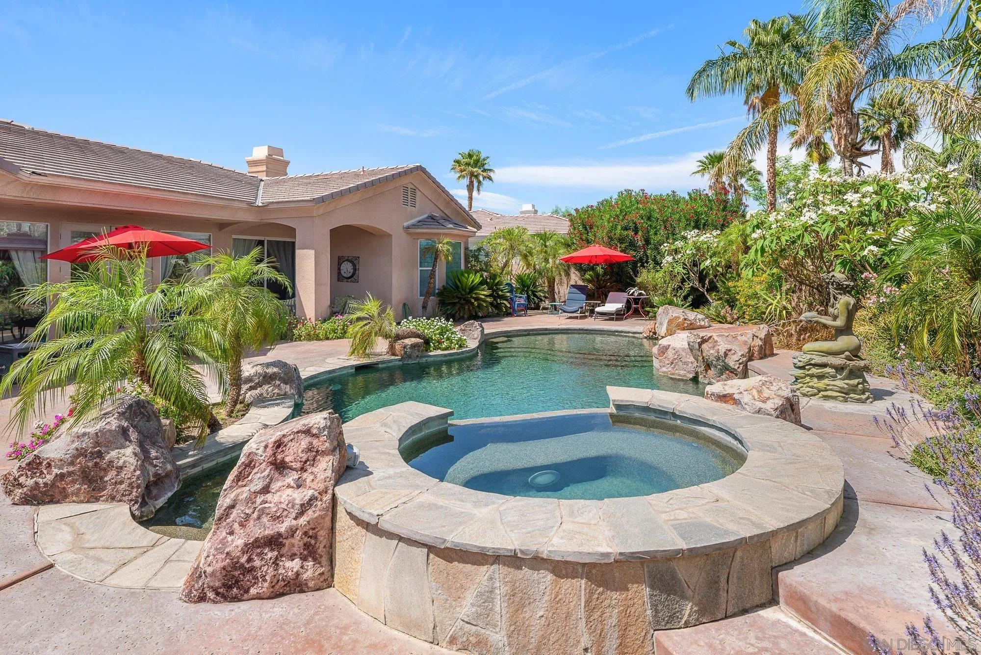 4 Chandon Court Rancho Mirage, CA 92270 - Photo 34 of 44 a view of swimming pool with a table and chairs