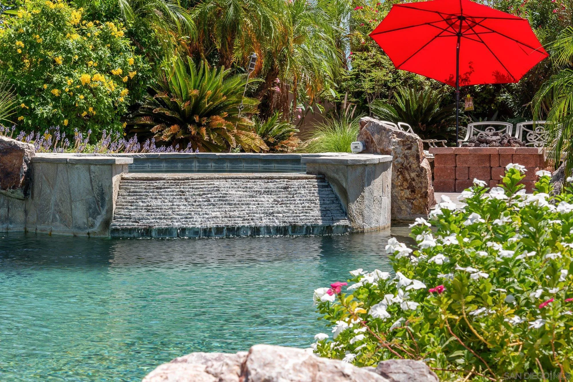 4 Chandon Court Rancho Mirage, CA 92270 - Photo 36 of 44 a view of a wooden bridge with potted plants