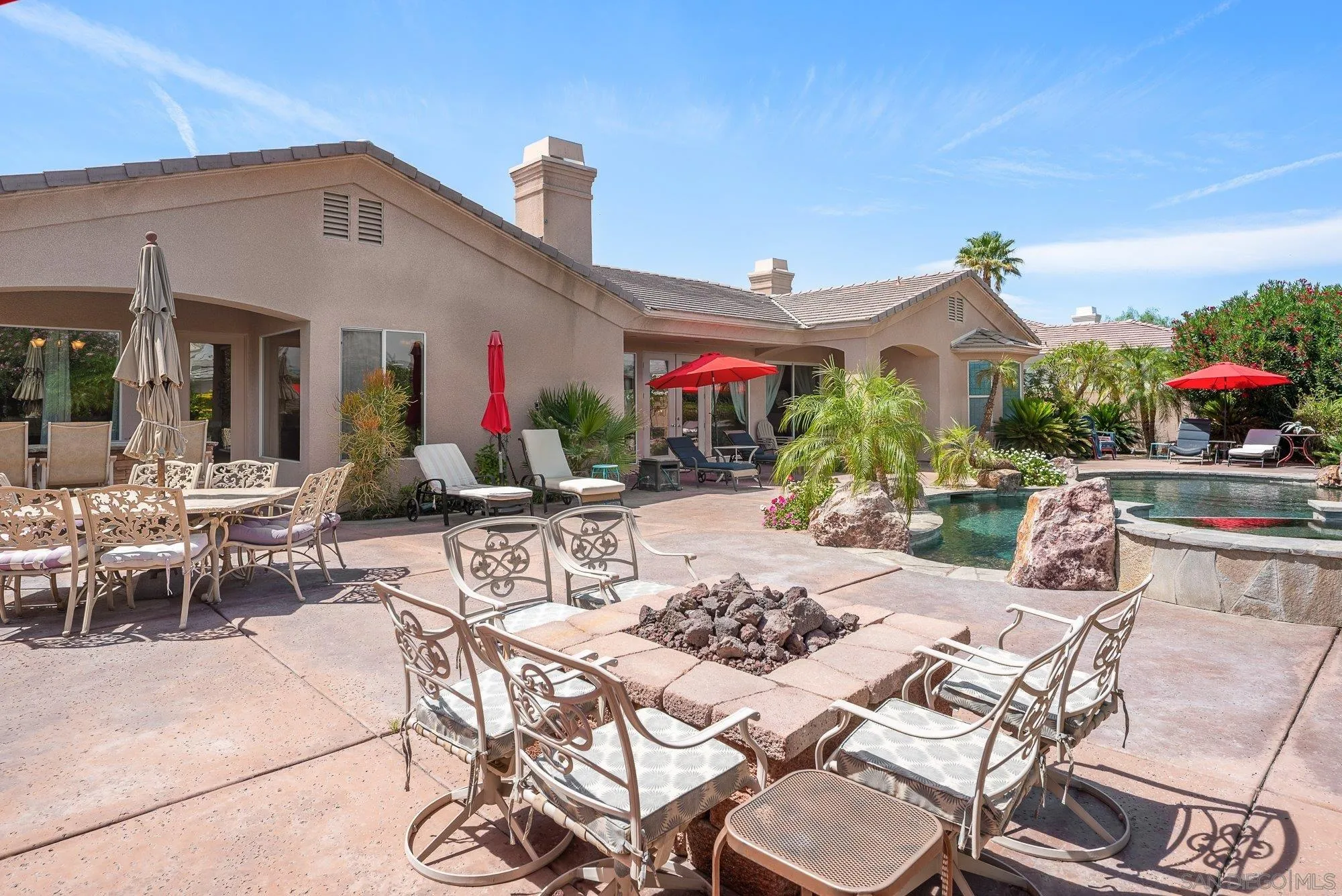 4 Chandon Court Rancho Mirage, CA 92270 - Photo 38 of 44 a view of a patio with table and chairs potted plants