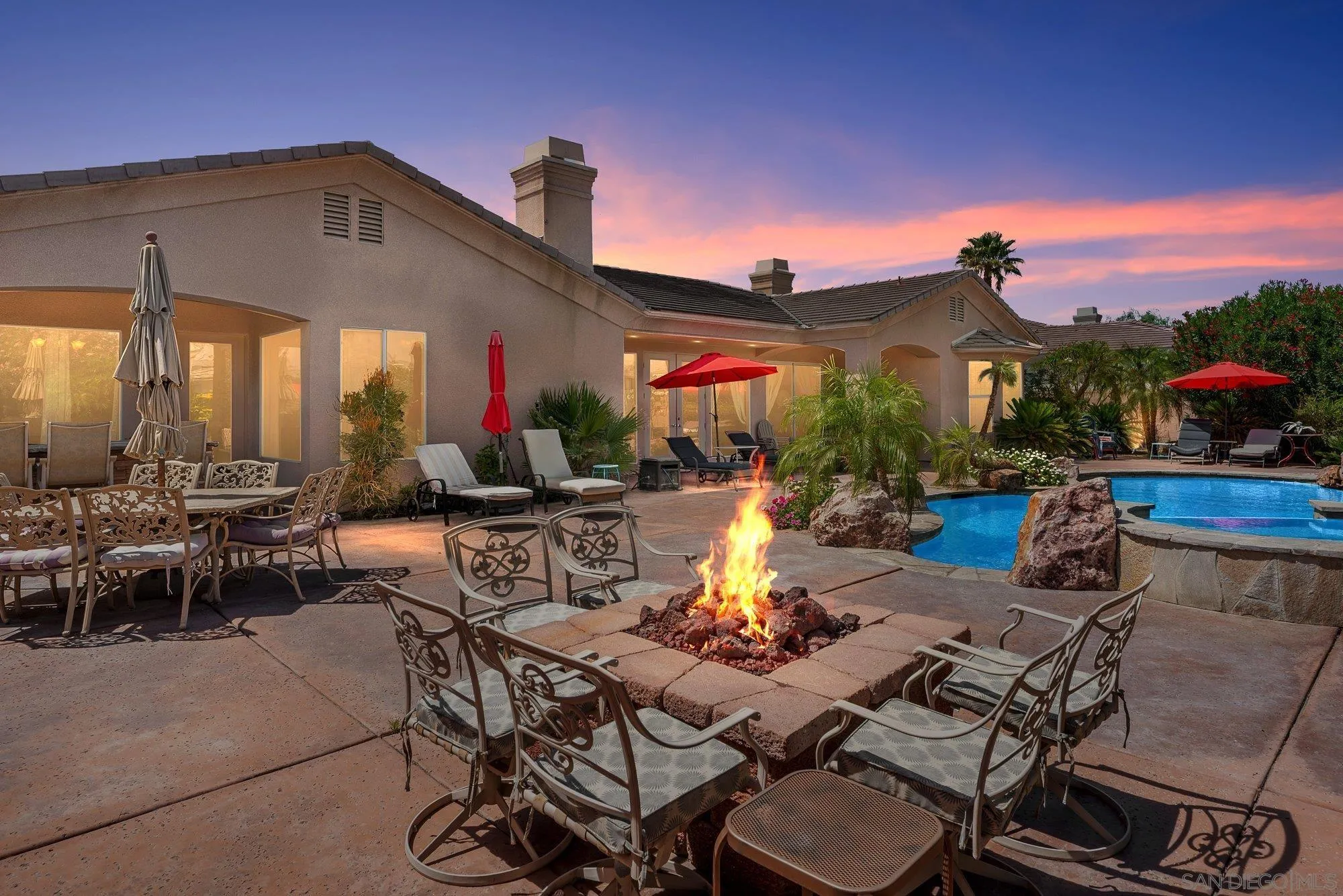 4 Chandon Court Rancho Mirage, CA 92270 - Photo 4 of 44 a view of a patio with couches table and chairs with plants
