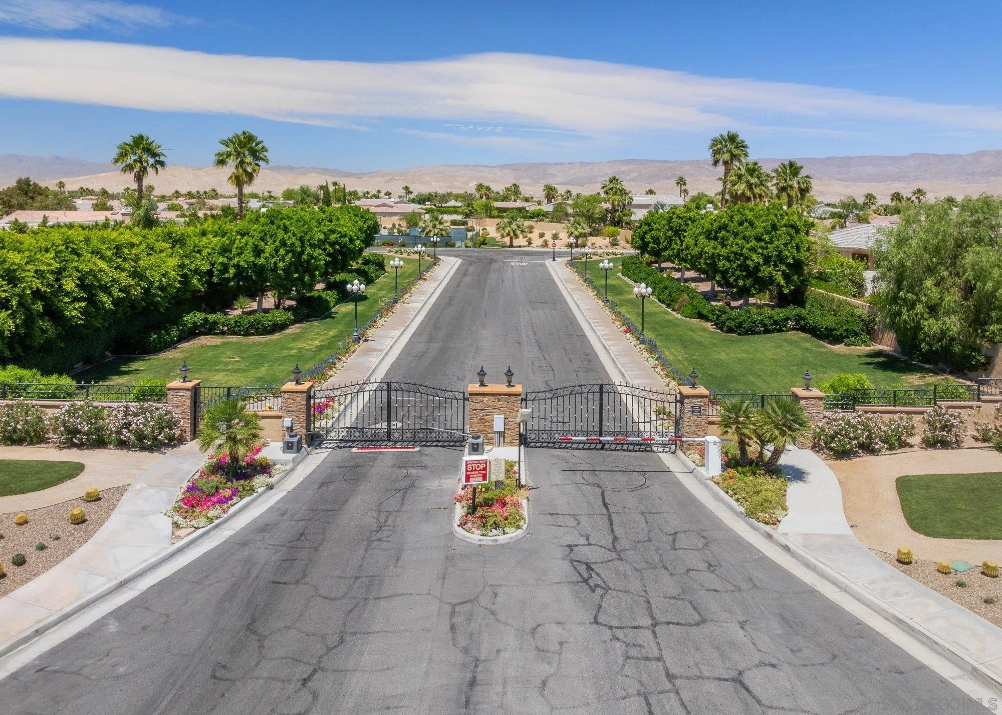 4 Chandon Court Rancho Mirage, CA 92270 - Photo 43 of 44 a view of a swimming pool with a terrace and a garden