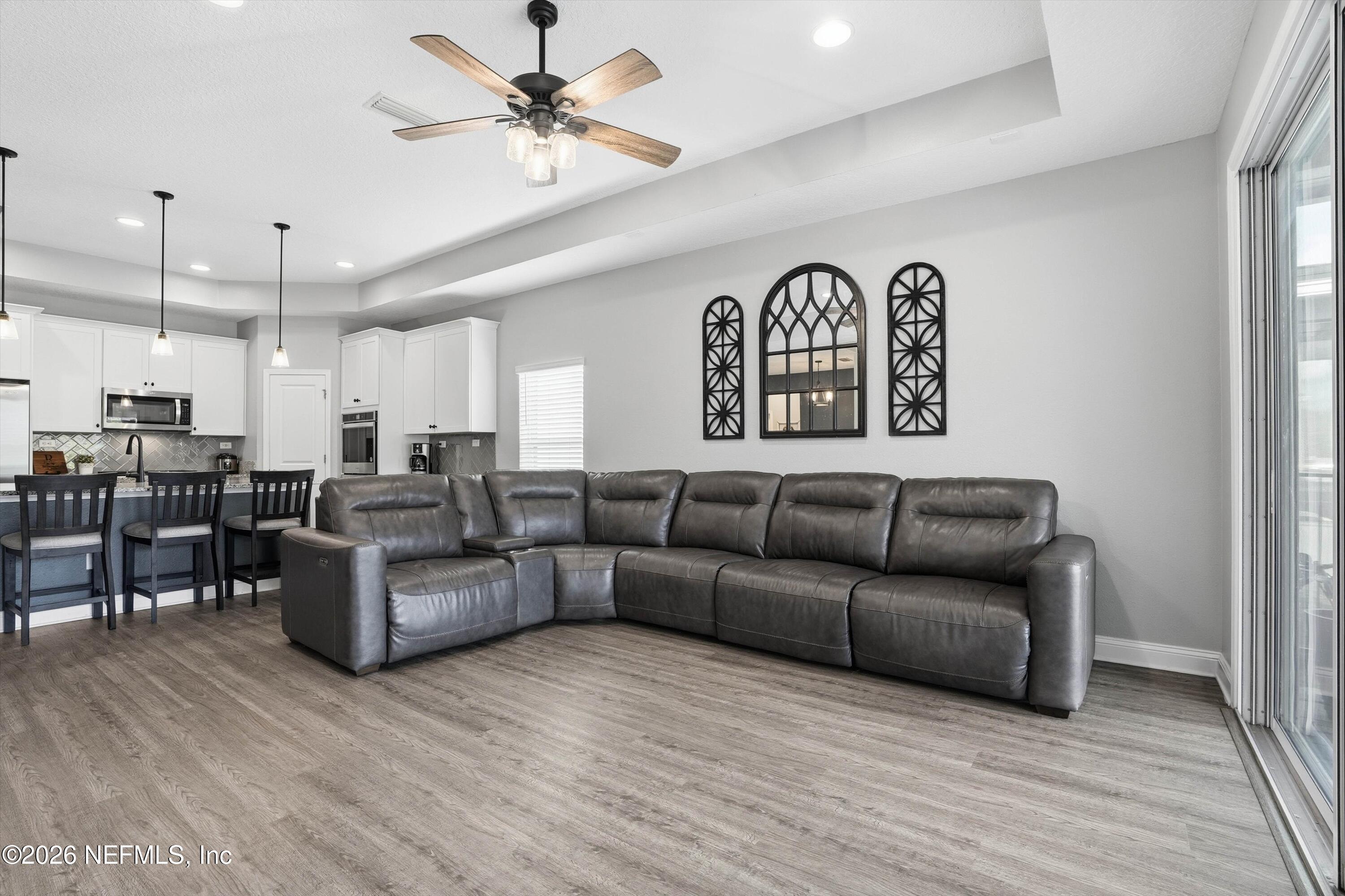 742 Sycamore Way Orange Park, FL 32073 - Photo 12 of 41 a living room with furniture and kitchen view