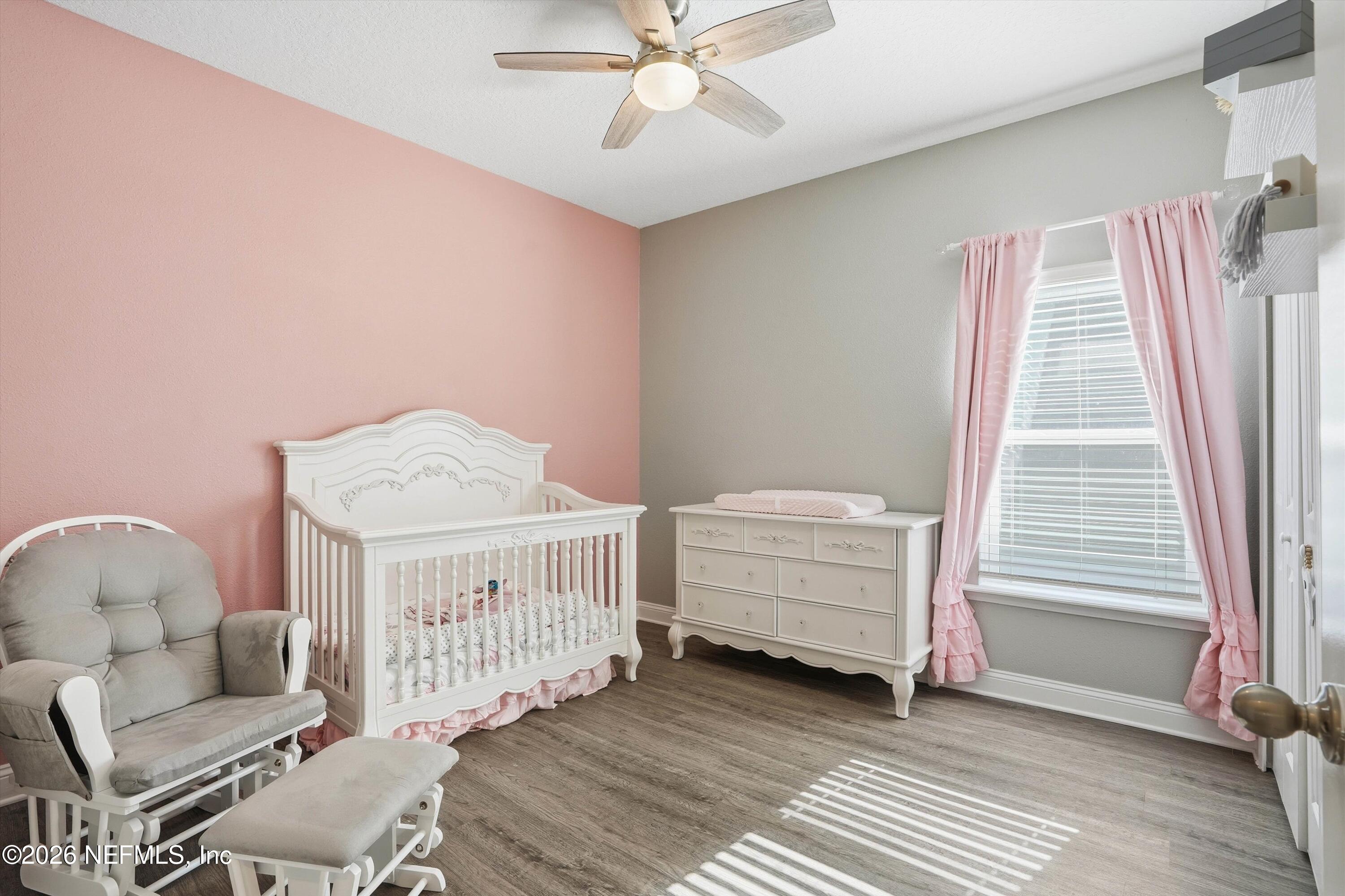 742 Sycamore Way Orange Park, FL 32073 - Photo 18 of 41 a bedroom with furniture and a window
