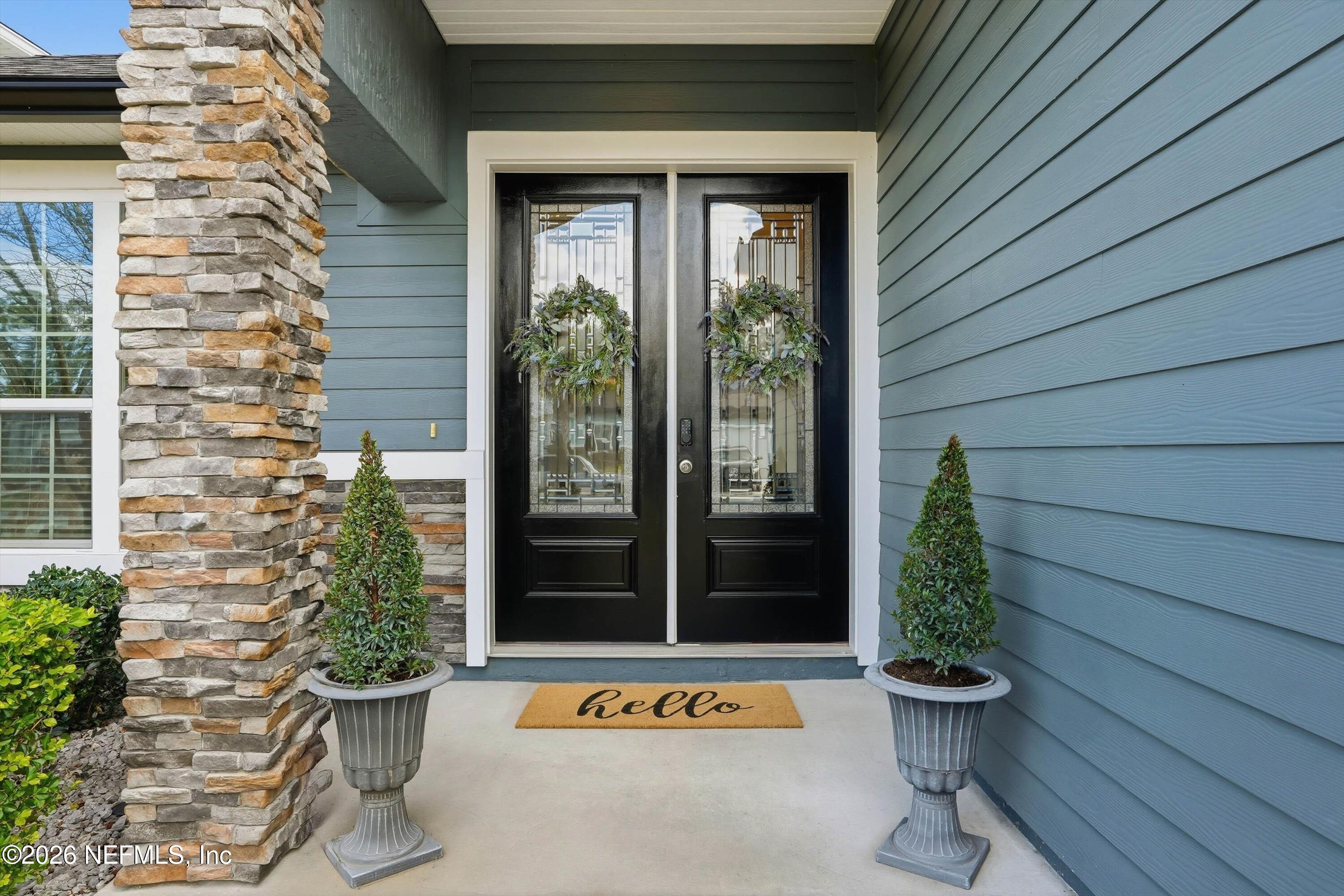 742 Sycamore Way Orange Park, FL 32073 - Photo 2 of 41 a view of a door and chair and door of the house