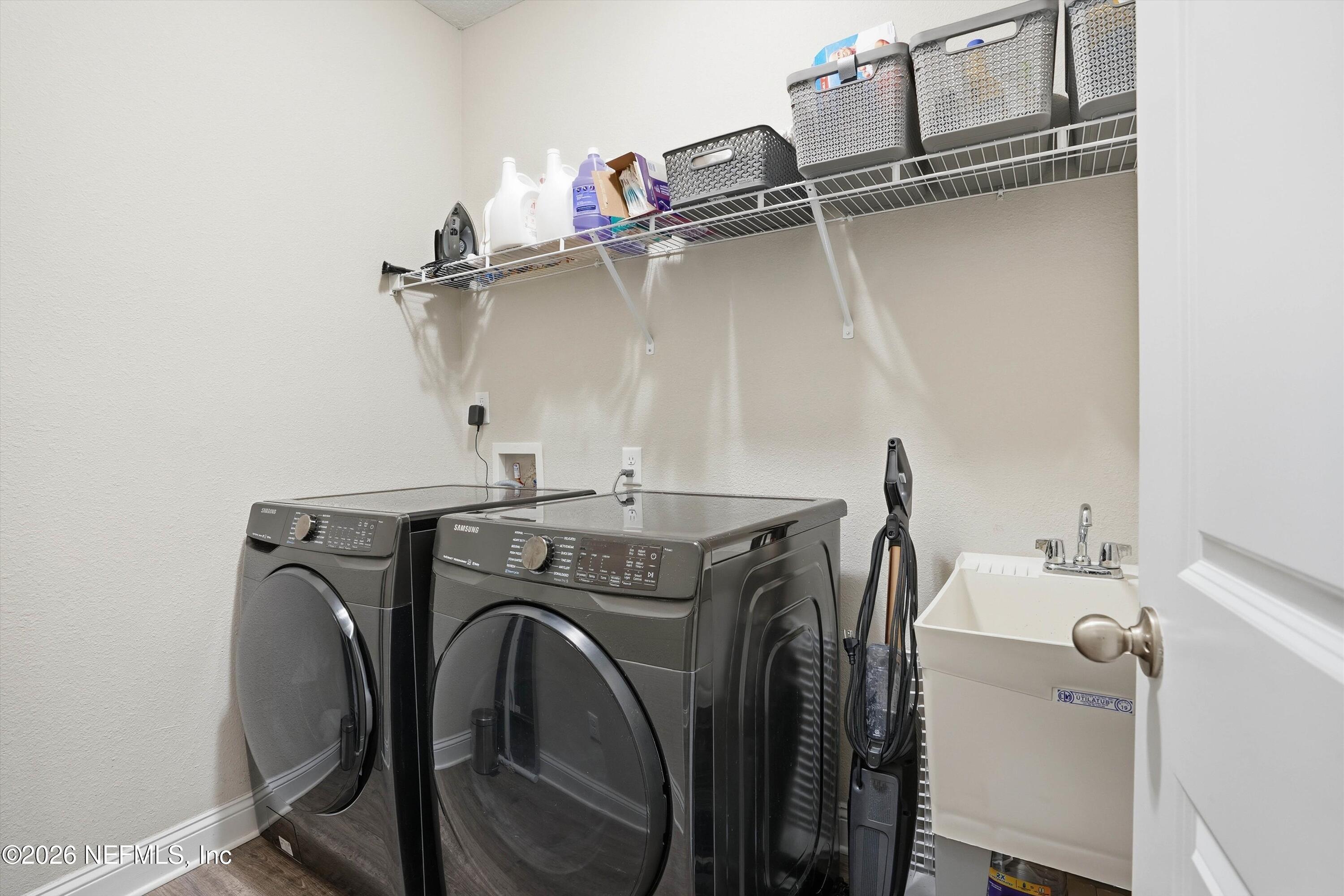 742 Sycamore Way Orange Park, FL 32073 - Photo 21 of 41 a utility room with dryer and washer