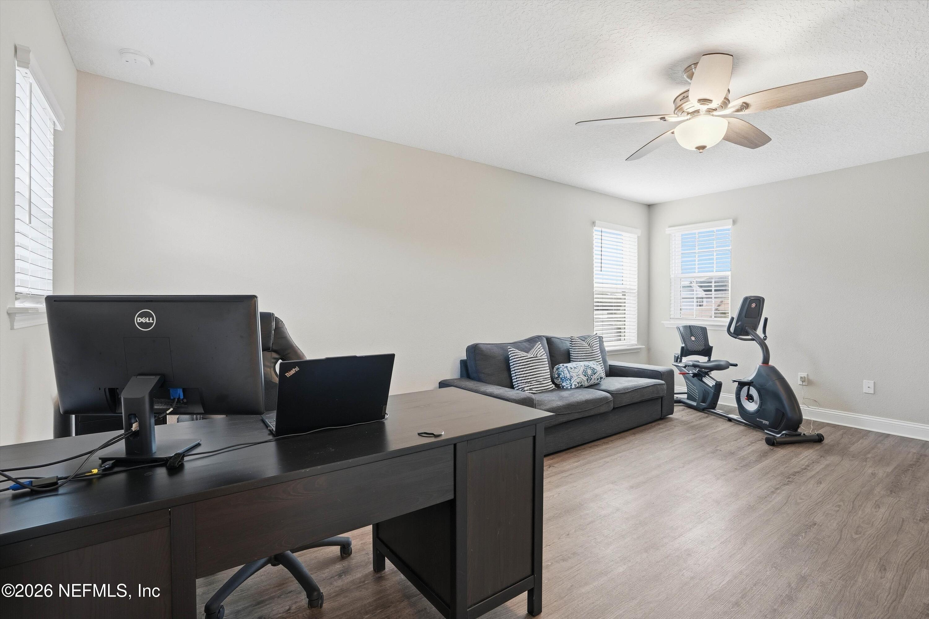 742 Sycamore Way Orange Park, FL 32073 - Photo 22 of 41 a living room with furniture and wooden floor