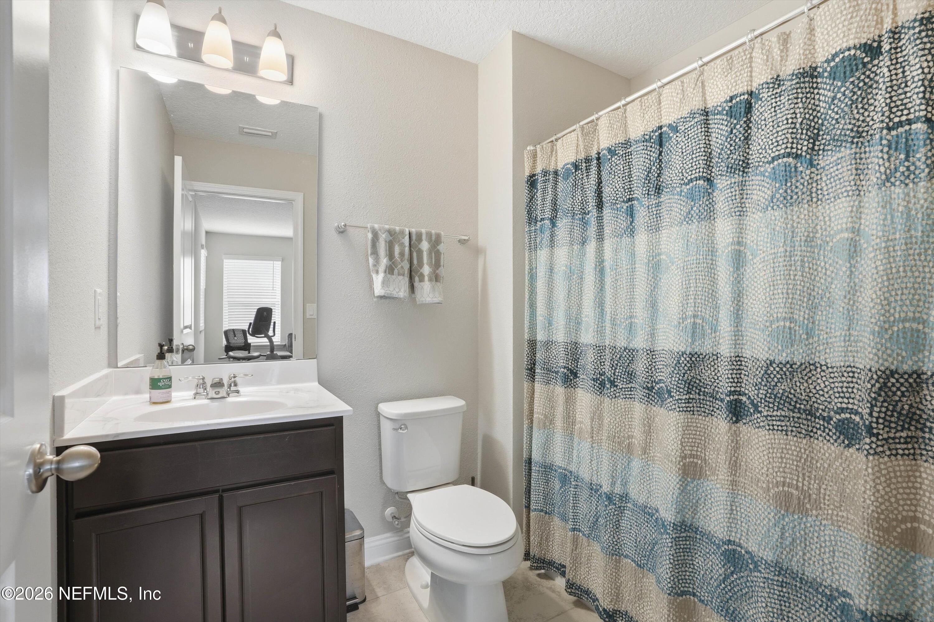 742 Sycamore Way Orange Park, FL 32073 - Photo 24 of 41 a bathroom with a sink a toilet and shower