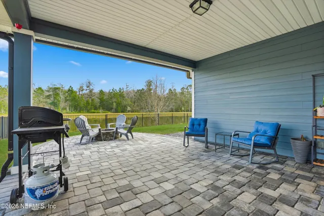 a view of a two chairs in the patio