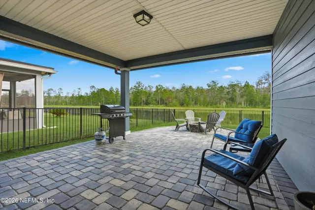 a view of a chairs and table in the patio