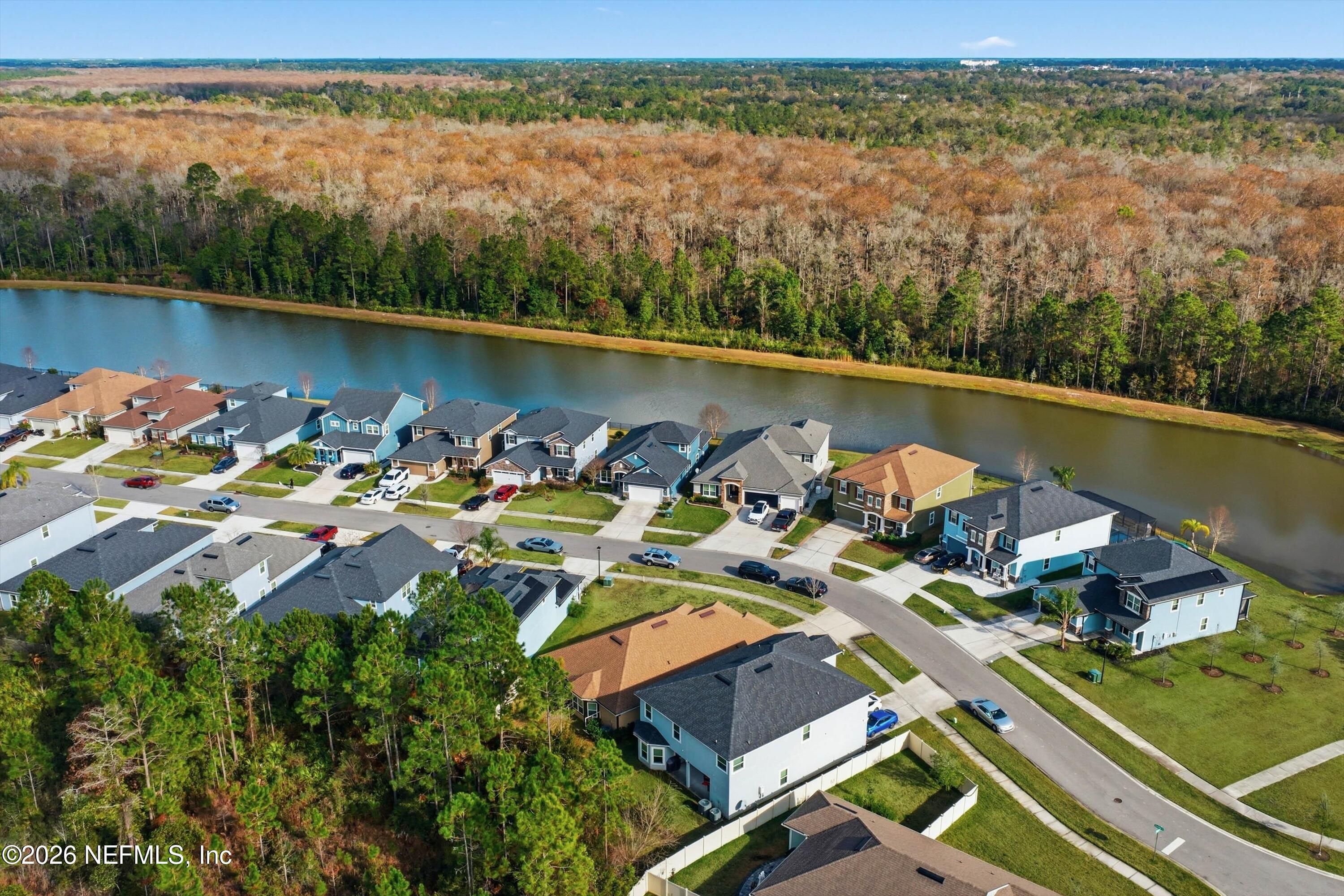 742 Sycamore Way Orange Park, FL 32073 - Photo 34 of 41 an aerial view of a house with a lake view