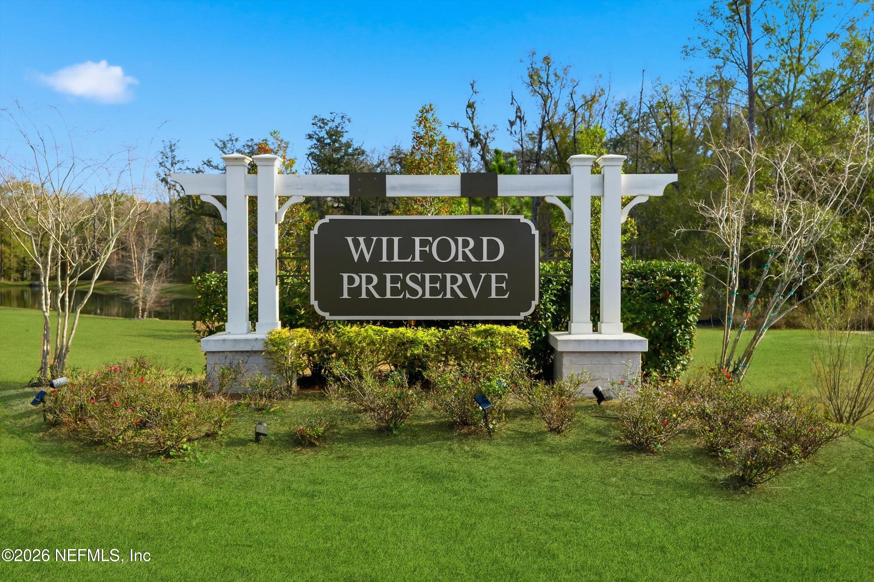 742 Sycamore Way Orange Park, FL 32073 - Photo 35 of 41 a view of outdoor space with garden and trees