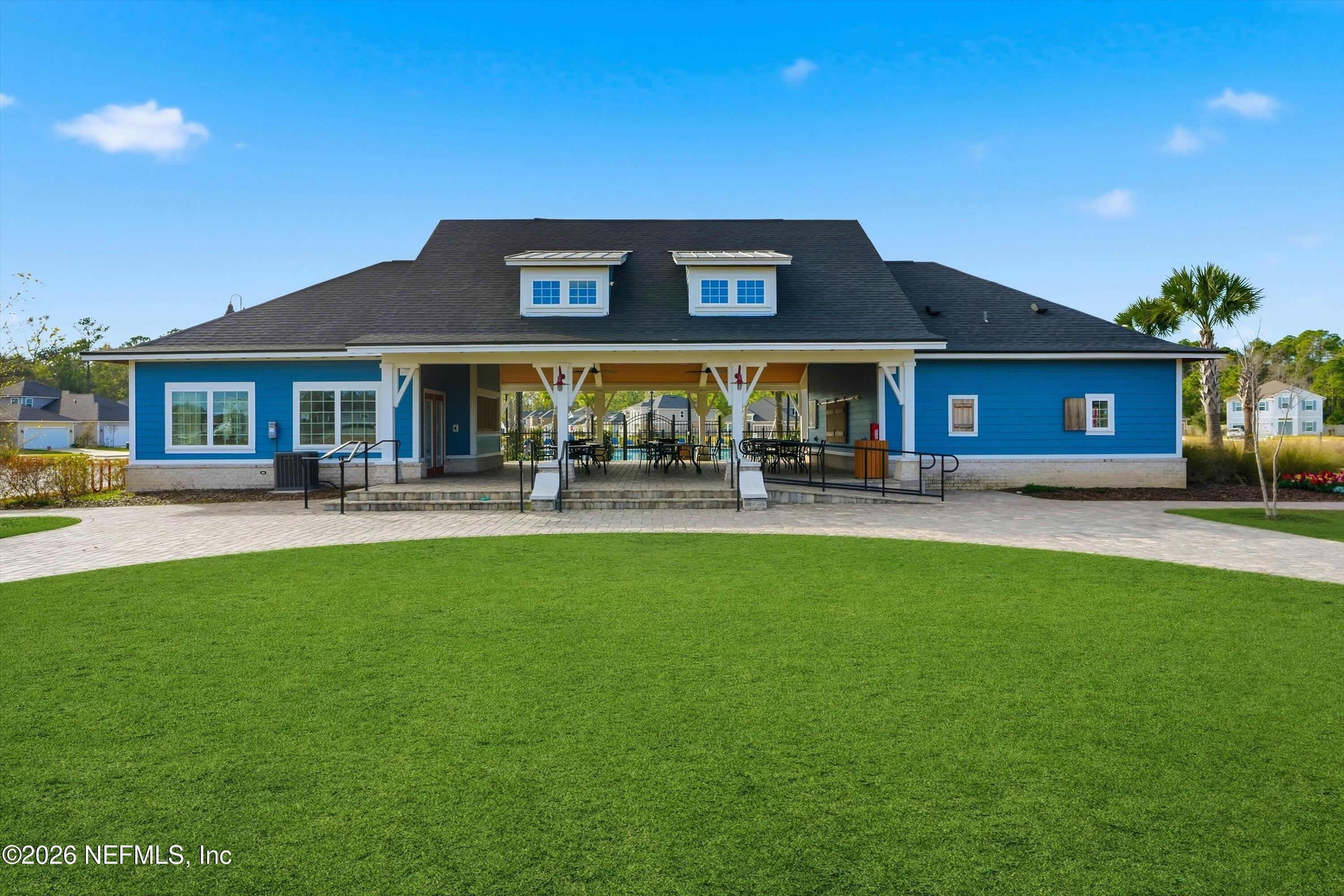 742 Sycamore Way Orange Park, FL 32073 - Photo 36 of 41 a front view of building with yard and outdoor seating