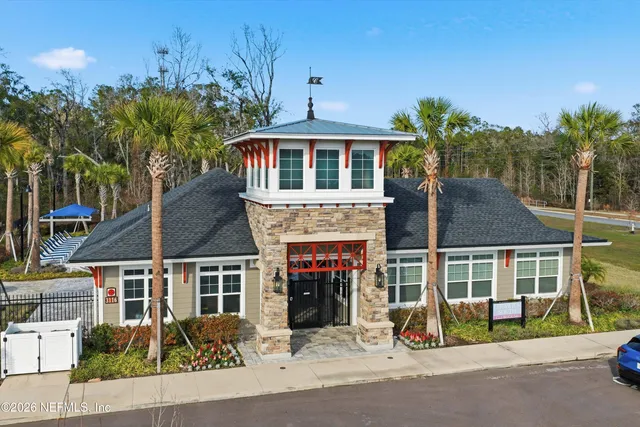 an aerial view of a house with outdoor space