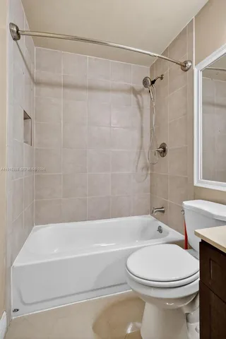 a bathroom with a toilet bathtub and shower