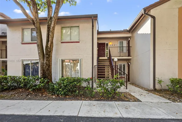 a view of a yard with swimming pool and sitting area
