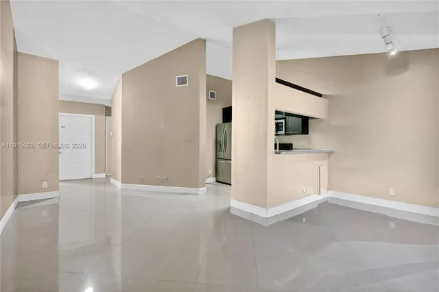 a view of a kitchen with a sink and dishwasher