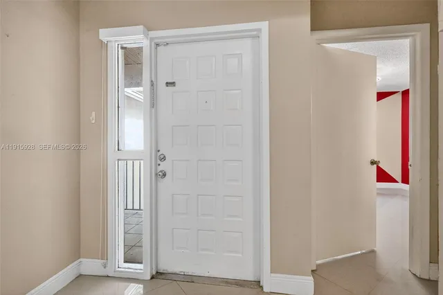 an empty room with wooden floor