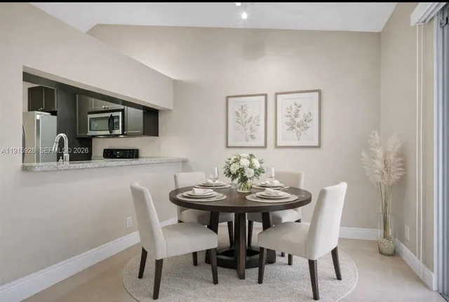 a view of a dining room with furniture