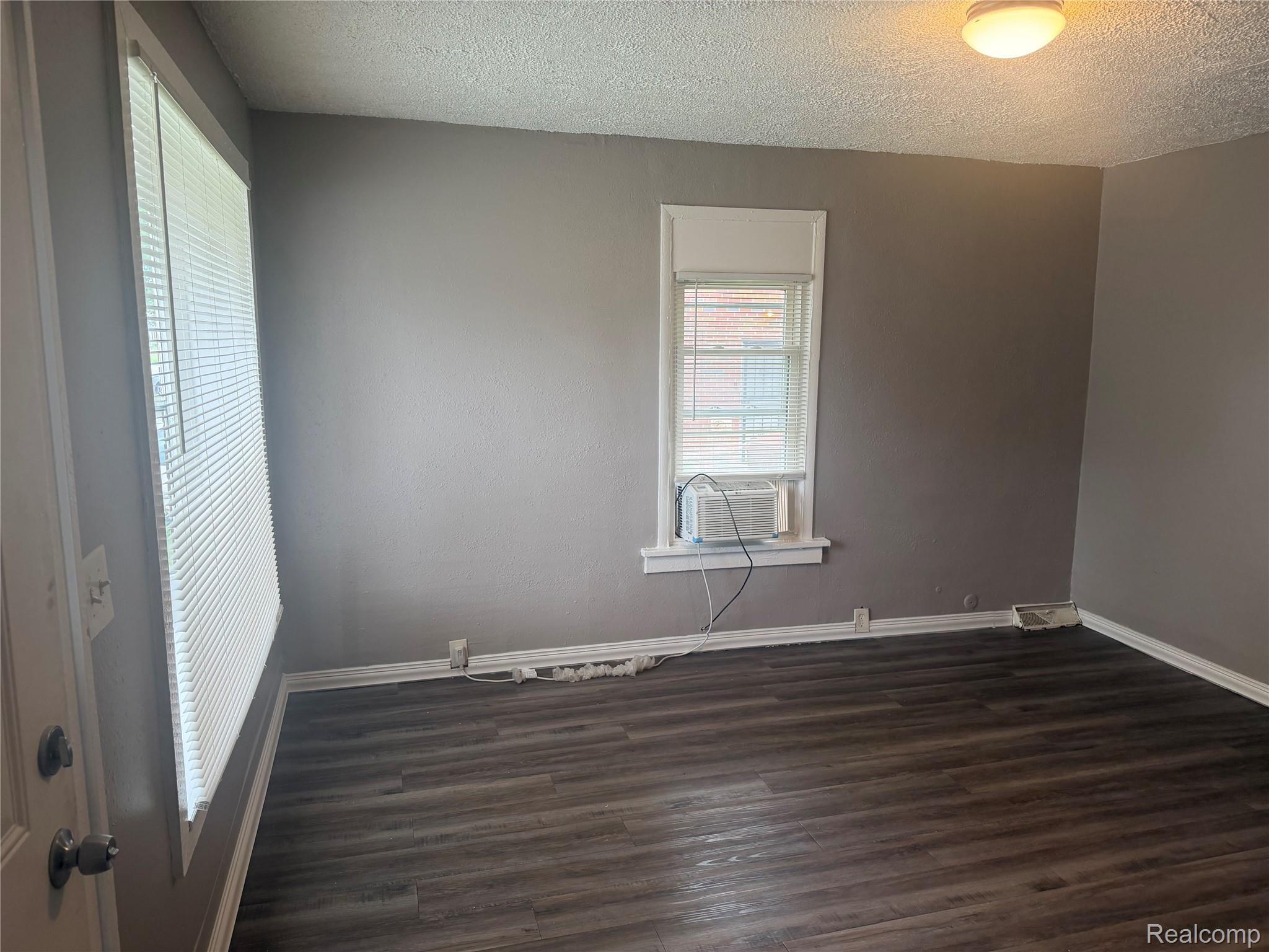3322 Isabelle Street Inkster, MI 48141 - Photo 3 of 13 Interior space featuring wood-finish flooring, neutral gray wall paint, and white trim