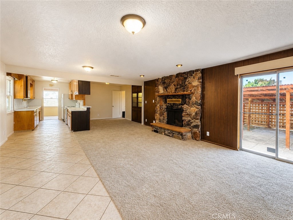 325 North Sanders Street Ridgecrest, CA 93555 - Photo 2 of 23 a view of a livingroom with furniture and a ceiling fan