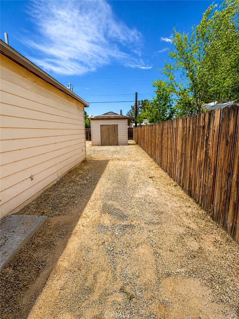 325 North Sanders Street Ridgecrest, CA 93555 - Photo 22 of 23 a view of backyard with wooden fence