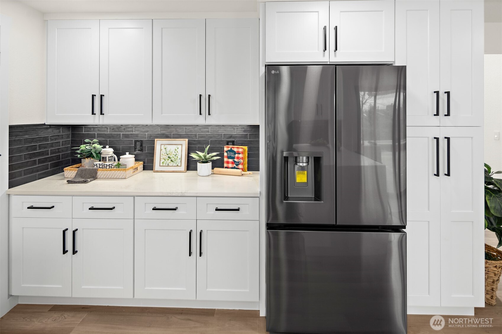2219 236th Street Southeast Bothell, WA 98021 - Photo 12 of 34 a kitchen with stainless steel appliances granite countertop a refrigerator and a cabinets