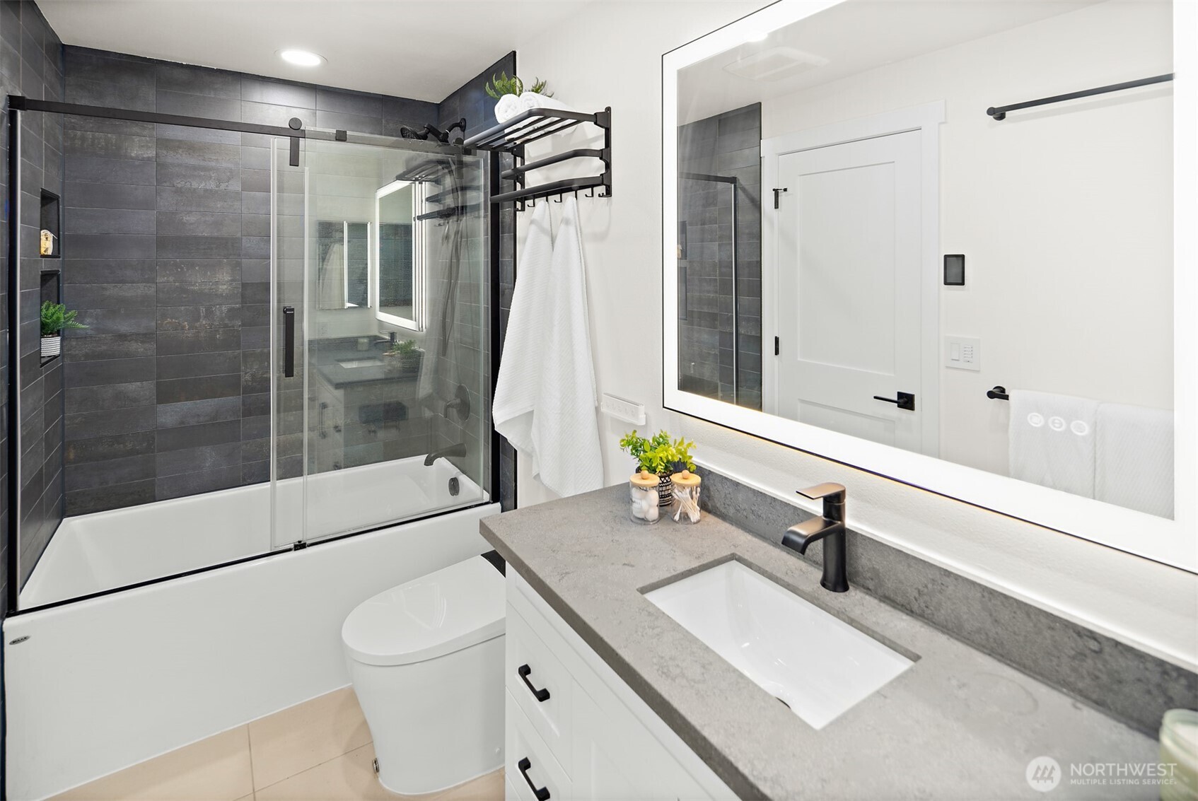 2219 236th Street Southeast Bothell, WA 98021 - Photo 16 of 34 a bathroom with a sink toilet and shower