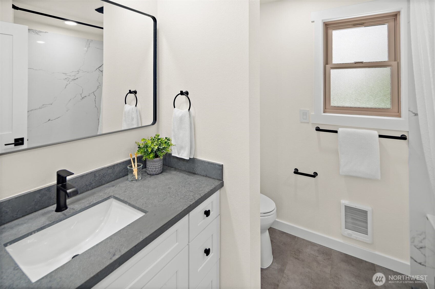 2219 236th Street Southeast Bothell, WA 98021 - Photo 20 of 34 a bathroom with a granite countertop sink a toilet and shower