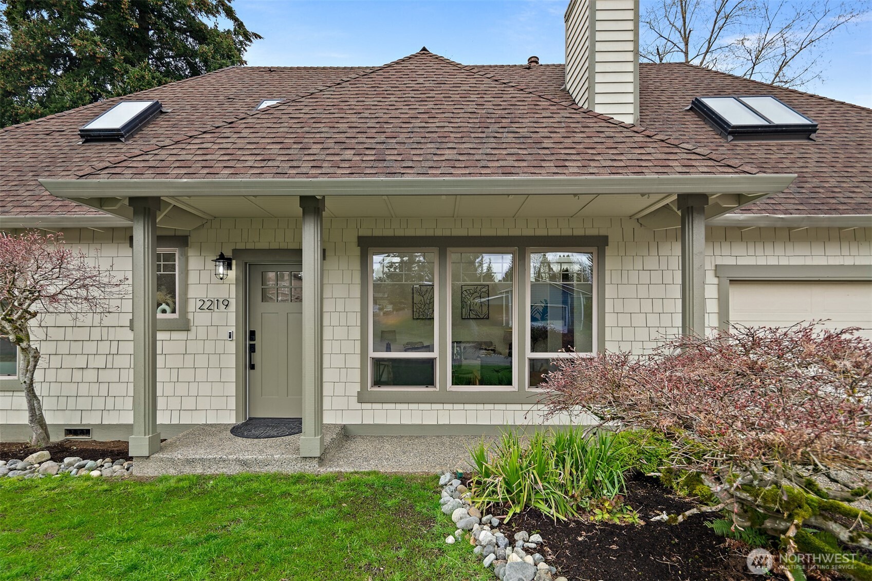 2219 236th Street Southeast Bothell, WA 98021 - Photo 2 of 34 a view of a brick house with a large windows