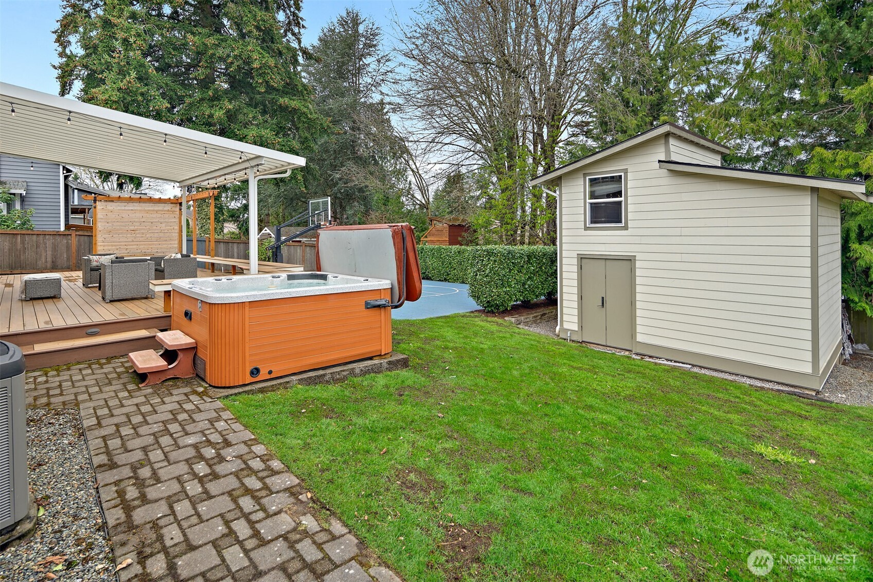 2219 236th Street Southeast Bothell, WA 98021 - Photo 27 of 34 a view of a house with backyard sitting area and garden
