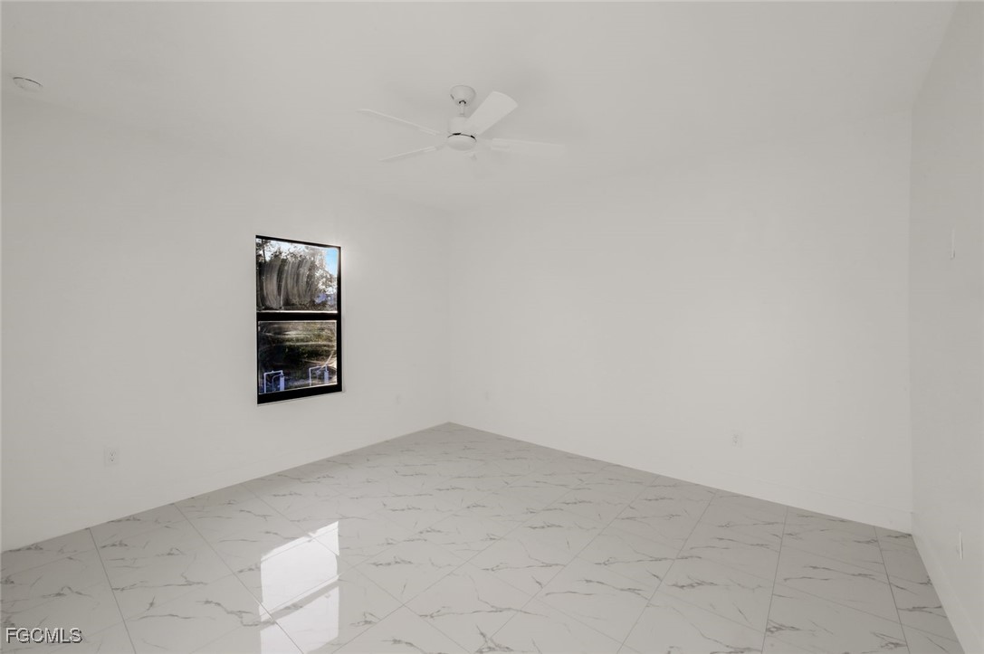 4805-4807 29th Street Southwest Lehigh Acres, FL 33973 - Photo 11 of 25 a view of an empty room with a window