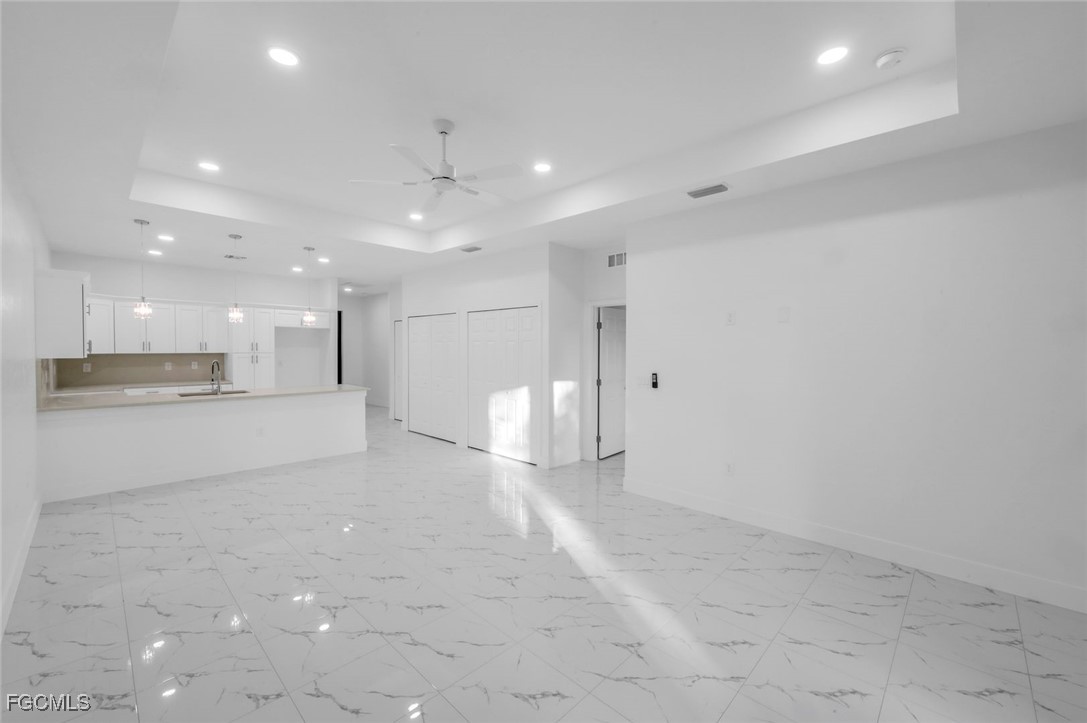 4805-4807 29th Street Southwest Lehigh Acres, FL 33973 - Photo 4 of 25 a view of a empty room