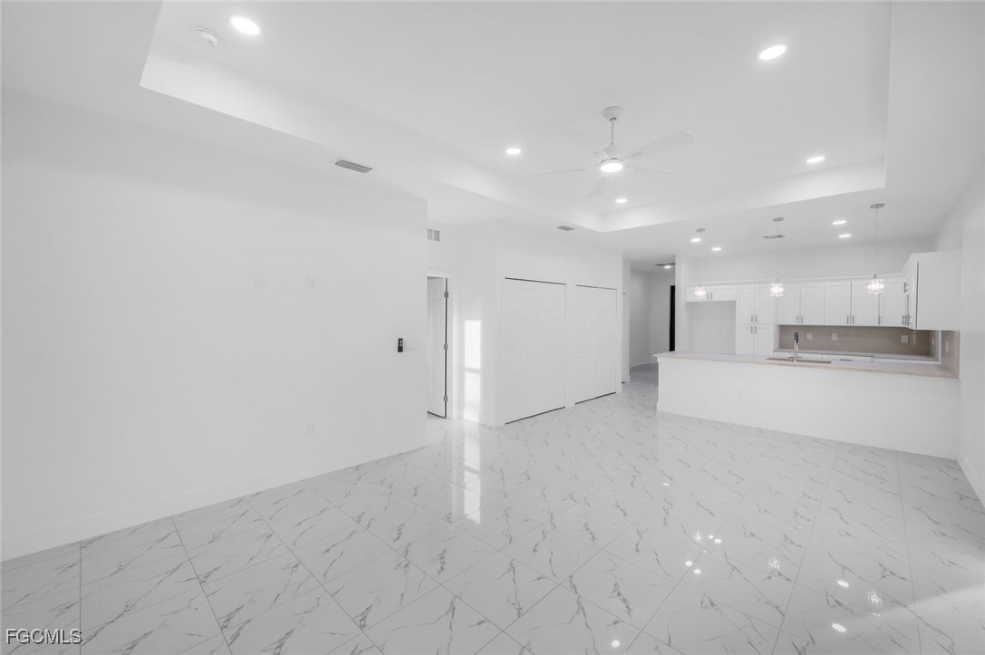 4805-4807 29th Street Southwest Lehigh Acres, FL 33973 - Photo 6 of 25 a view of an empty room and kitchen view