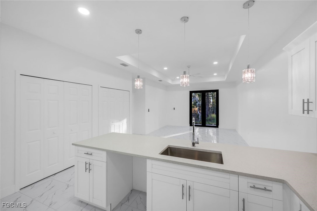 4805-4807 29th Street Southwest Lehigh Acres, FL 33973 - Photo 8 of 25 a bathroom with a sink and a mirror