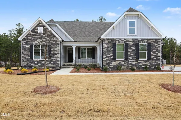 a front view of a house with yard