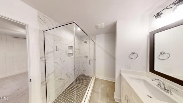 a bathroom with a sink and a shower