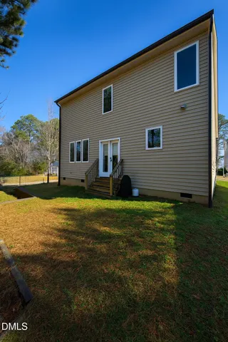 a front view of house with yard and seating space