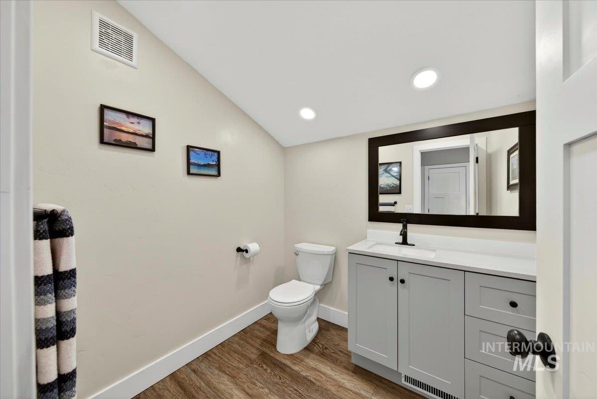 414 East Shafer View Drive Meridian, ID 83642 - Photo 43 of 50 Bathroom featuring a light-colored vanity with a white countertop, a black framed mirror, recessed lighting, toilet on LVP flooring w/room for corner shower in the future!