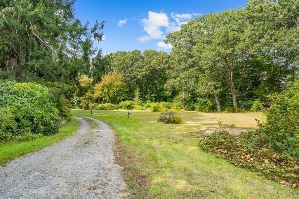 48 Neal Gate Street Scituate, MA 02066 - Photo 23 of 34 a view of a swimming pool with an outdoor space and seating area